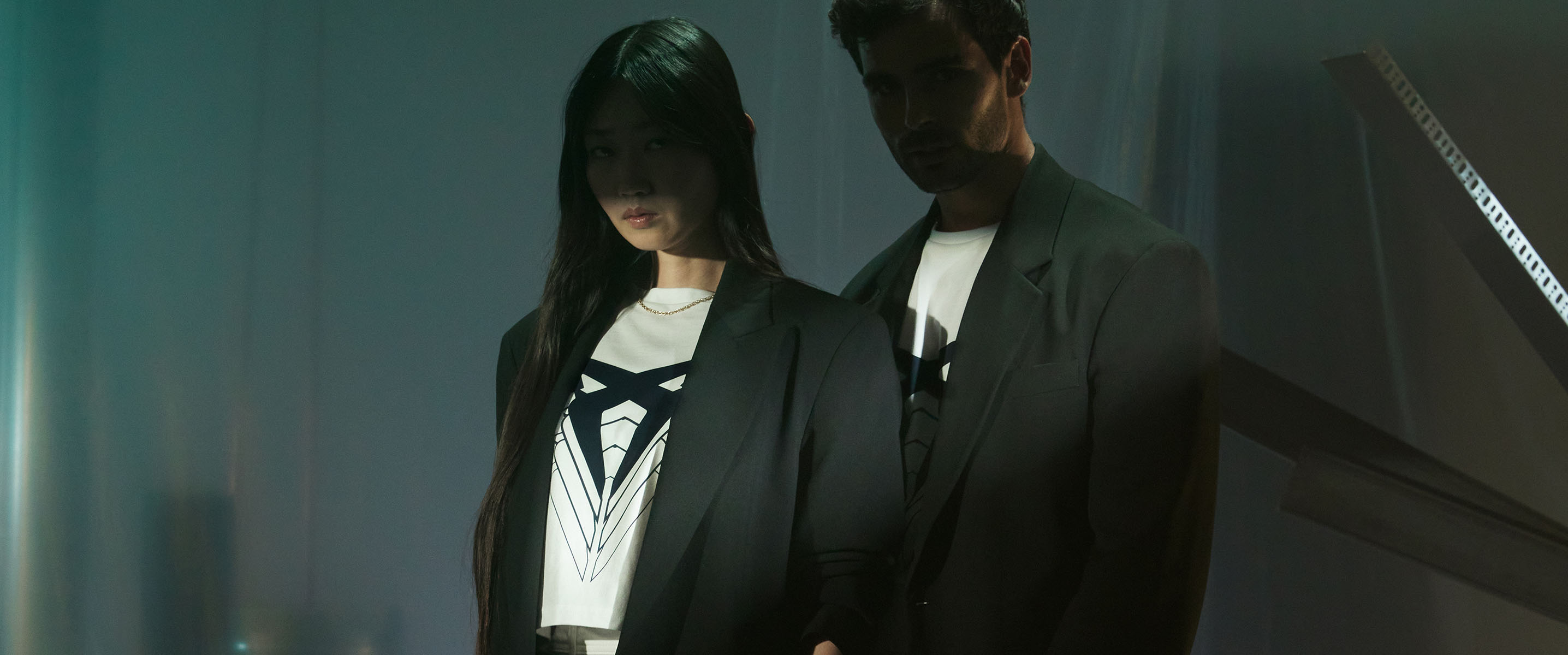 a woman and a man posing with CUPRA t-shirts