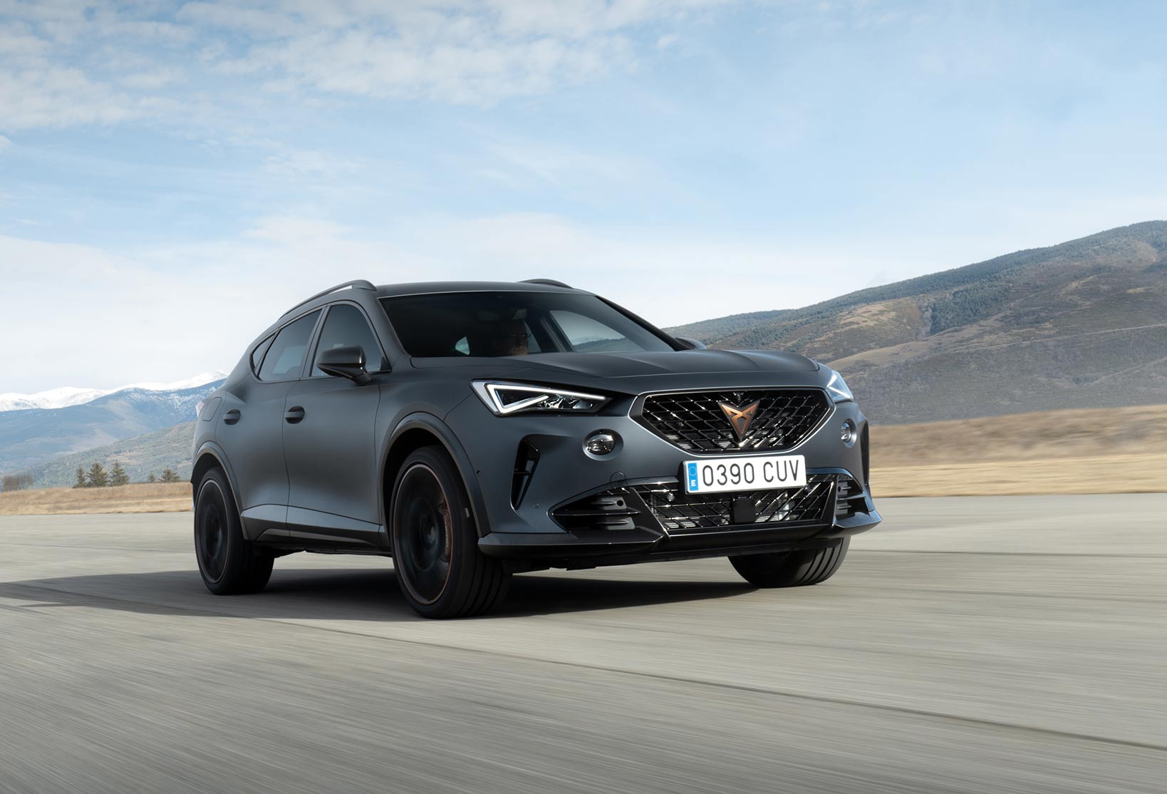 A Magnetic Tech Matte CUPRA Formentor driving through the highway